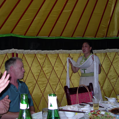 Tony's_Birthday-009 Waitress singing Mongolian song and presenting a hada (silk scarf) to Tony.