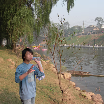 Tourism_Student_Outing-005 A student singing the racing song.