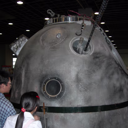 Space_Exhibit-010 Examining the capsule. Looks like it got pretty hot on reentry.