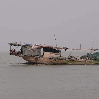 Boat-Buying-12 A fishing junk. Note the pile of green nets on the bow.