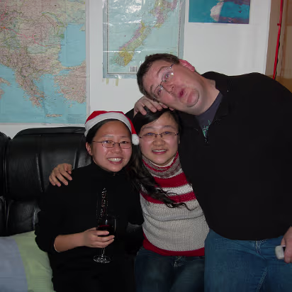 Christmas-2006-09 Hanhan, Becky, and Adam feeling the Christmas spirit.