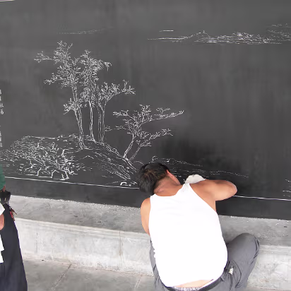 SoYangtziUniv-04 A craftsman etching a scene for a pavilion on campus.