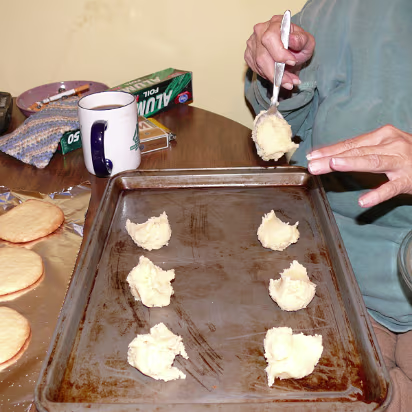 Christmas_2007-018 Baked cookies next to cookies getting ready for the oven.