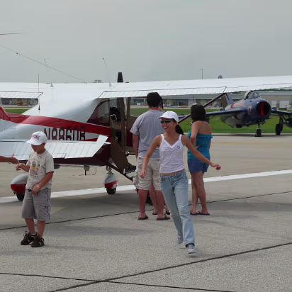 Prairie_Airshow_07-024 Hanhan runs to get her 'Young Eagle' certificate after her flight.