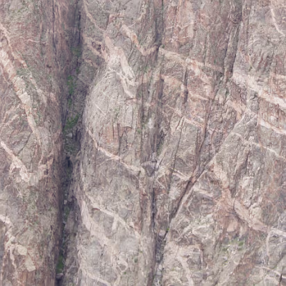 Black_Canyon_of_the_Gunnison_NP-037 The painted wall of the canyon, highest cliff in Coloado at 2250 feet. This was caused by molten rock being forced into cracks and crevasses in the extremely...
