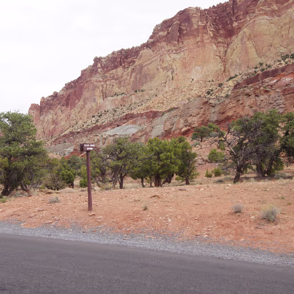 Capitol_Reef_NP-014 The sign says slick rock divide. Rainfall goes either into Grand Wash or Capitol Gorge.